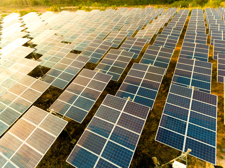 Beautiful sunset over Solar Farm with sunset on the backgroundの写真素材