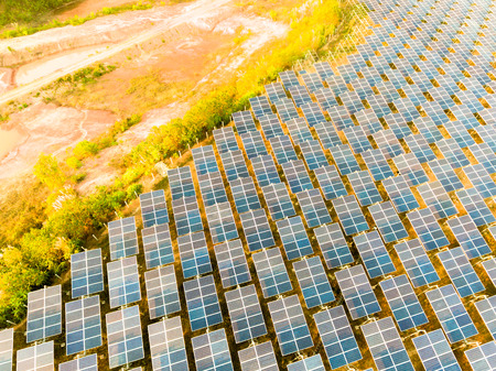 Beautiful sunset over Solar Farm with sunset on the backgroundの写真素材