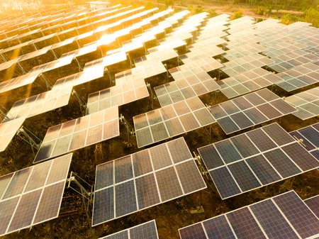 Beautiful sunset over Solar Farm with sunset on the backgroundの写真素材