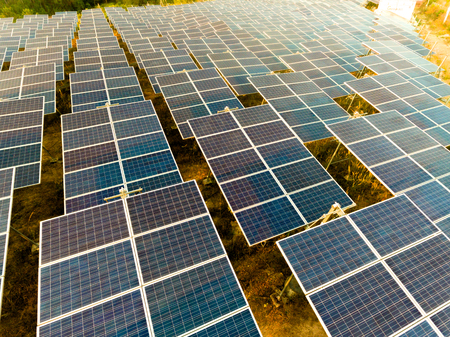 Beautiful sunset over Solar Farm with sunset on the backgroundの写真素材
