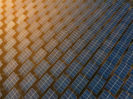 Beautiful sunset over Solar Farm Top viewの写真素材