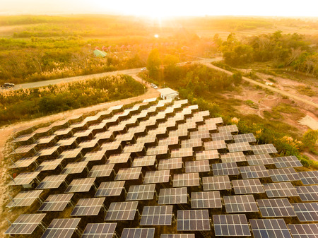 Beautiful sunset over Solar Farm with sunset on the backgroundの写真素材