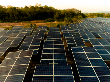 Beautiful sunset over Solar Farm with sunset on the backgroundの写真素材