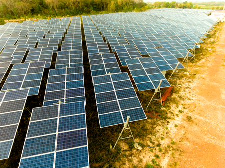 Beautiful sunset over Solar Farm with sunset on the backgroundの写真素材