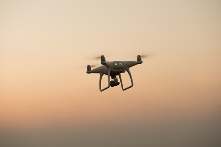 Drone flying on a mountain view at beautiful twilight sky. Vehicle at sundown and copy space.の写真素材