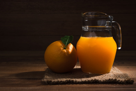 Orange juice on wood table.の写真素材