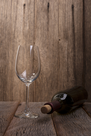 Wine and glass on wooden backgroundの写真素材