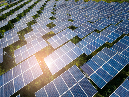 Beautiful sunset over Solar Farm with sunset on the backgroundの写真素材
