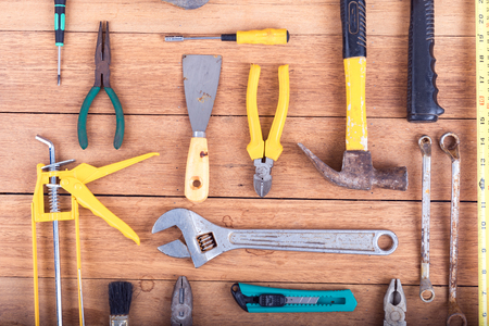 The wrench and Tools equipment  On a wooden table backgroundの写真素材
