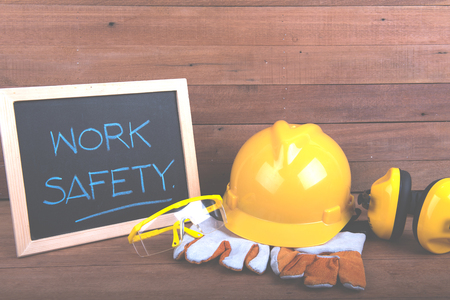 Standard construction safety,Safety equipment on wooden background with copy spaceの写真素材