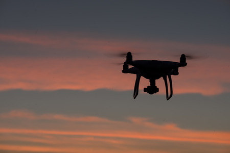 Flying drone above the professional camera takes pictures of the Skyの写真素材
