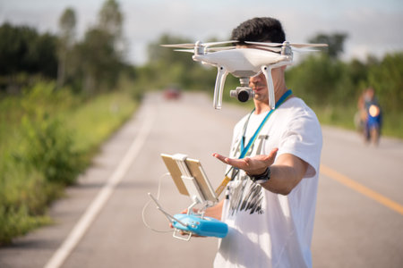 photographer  operating a drone with remote control