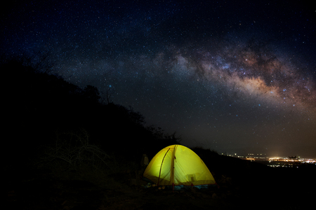 The Milky Way  on Mountain Yellow Camping Tent   in Thailandの写真素材