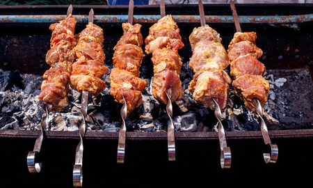 pork kebabs grilling at natureの写真素材