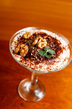 tiramisu in glass decorated by walnutの写真素材