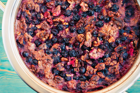 healthy breakfast, baked oatmeal with berries and nuts, tonedの写真素材
