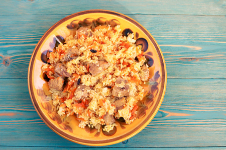 Pilaf with meat and carrot, traditional oriental rice, tonedの写真素材