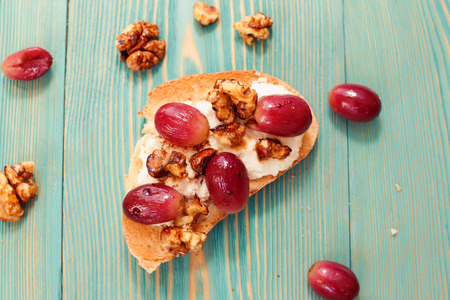 toast with walnut, ricotta and red grapeの写真素材