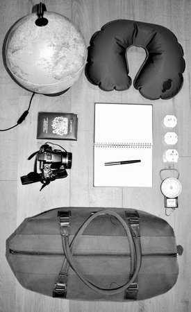 Flat lay of a travel concept, depicting a globe and deciding where to go next.  Creating a bucket...