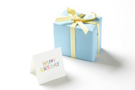 blue gift box on white background. 
blue Gift box with yellow ribbon. 
の写真素材