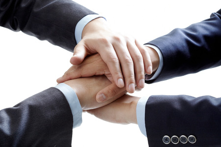 business people hands on top of each otherの写真素材