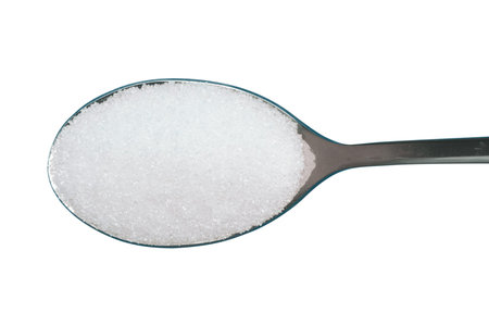Spoonful of white sugar isolated on white background