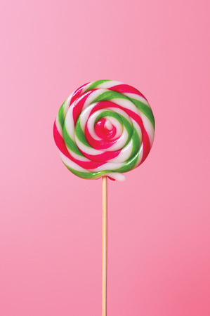 Colorful candy lollipops round pink background.の写真素材