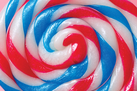 Colorful candy lollipops round pink background.の写真素材