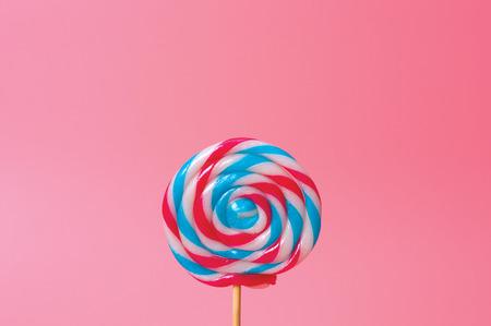 Colorful candy lollipops round pink background.の写真素材