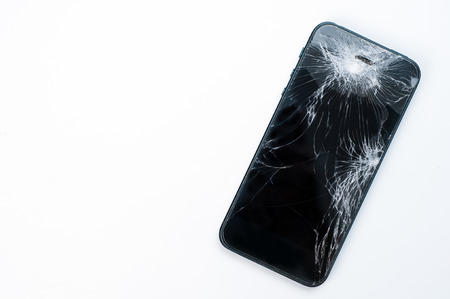 Mobile smartphone with broken screen isolated on white background with.の写真素材