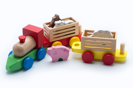 Wooden toy train with colorful blocks isolated over white.の写真素材