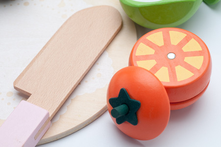 Fruits wooden toy isolated on white backgroundの写真素材