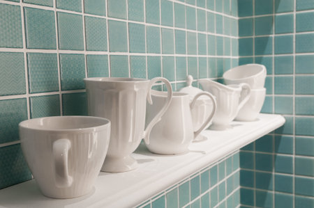 Clean cups on wooden shelfの写真素材