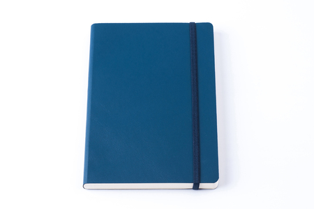 Blue leather notebook isolated on white background.の写真素材