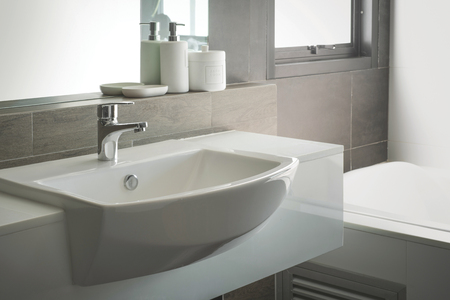 Bathroom interior with sink and faucet.の写真素材