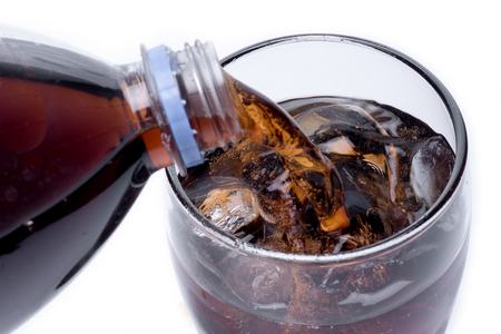 Ice cola with splashing, bubbles. Drink with iceの写真素材