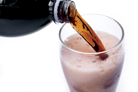 Ice cola with splashing, bubbles. Drink with iceの写真素材