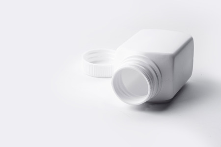 White plastic medicine bottle on white background.の写真素材