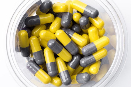 pile of medical pills and pills on backgroundの写真素材