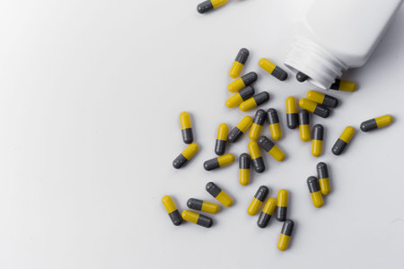 pills capsules an pill bottle on white background