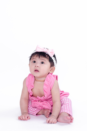 Asian girl 6 months old on a white backgroundの写真素材