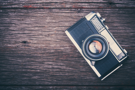 BANGKOK,THAILAND - JUNE 19,2017 : Retro film camera on wooden background.のeditorial素材