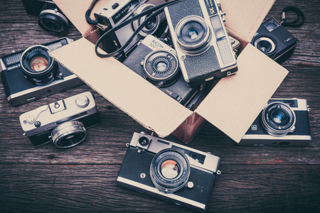 BANGKOK,THAILAND - JUNE 19,2017 : Retro film cameras on wooden background.のeditorial素材