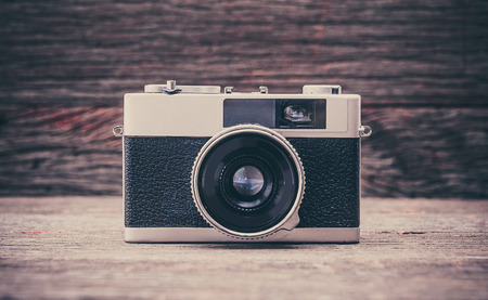 BANGKOK,THAILAND - JUNE 19,2017 : Retro film camera on wooden background.のeditorial素材