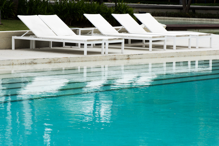 Swimming pool and white pool bed.の写真素材