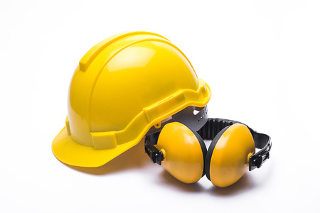 Yellow safety helmet isolated on white backgroundの写真素材