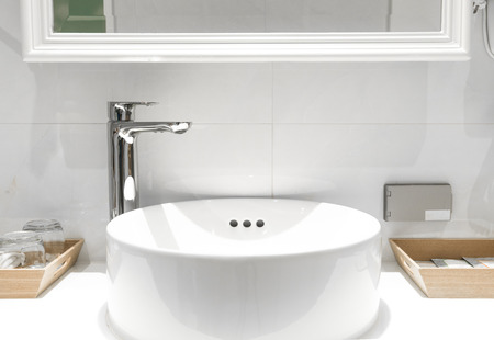 Bathroom interior with sink and faucet.の写真素材