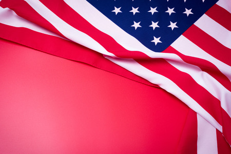 Closeup of American flag on red backgroundの写真素材