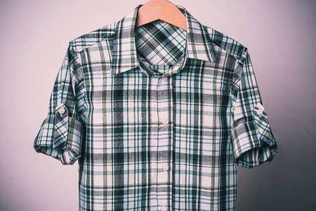 Man's green white cotton plaid shirt on white backgroundの写真素材