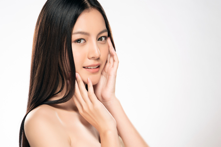 Beautiful Young asian Woman with Clean Fresh Skin look. Girl beauty face care. Facial treatment. Cosmetology, beauty and spa.の写真素材